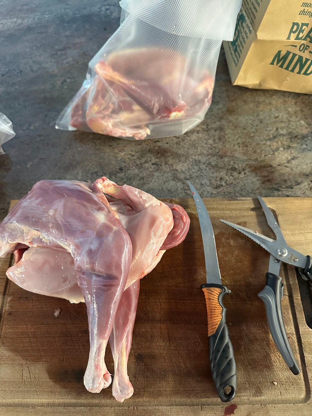 Skinless chicken on a butcher block